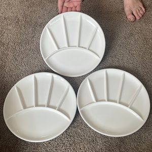A set of 3 condiment plates, white and have been fairly used
